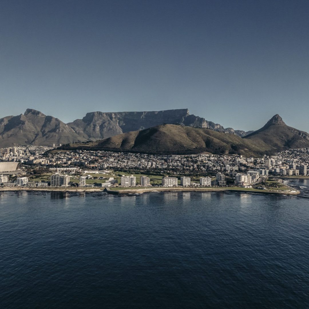 Aerial view of Cape Town's coastline with Table Mountain and Lion's Head behind the city, South Africa
